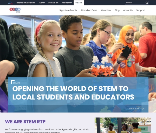 A website with a large photo of smiling school kids. The text says 'Opening the world of STEM to local students and educators.'