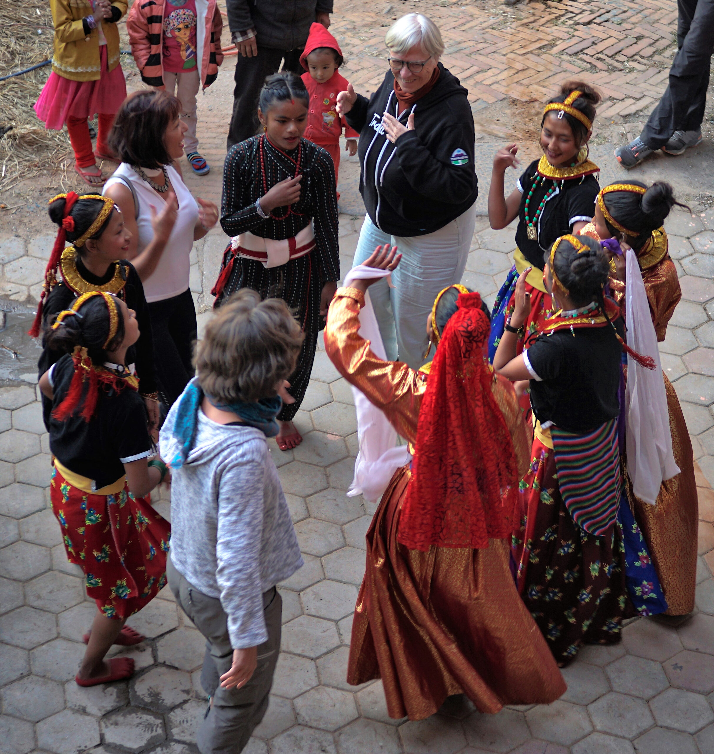 Trish dancing with women from the local community
